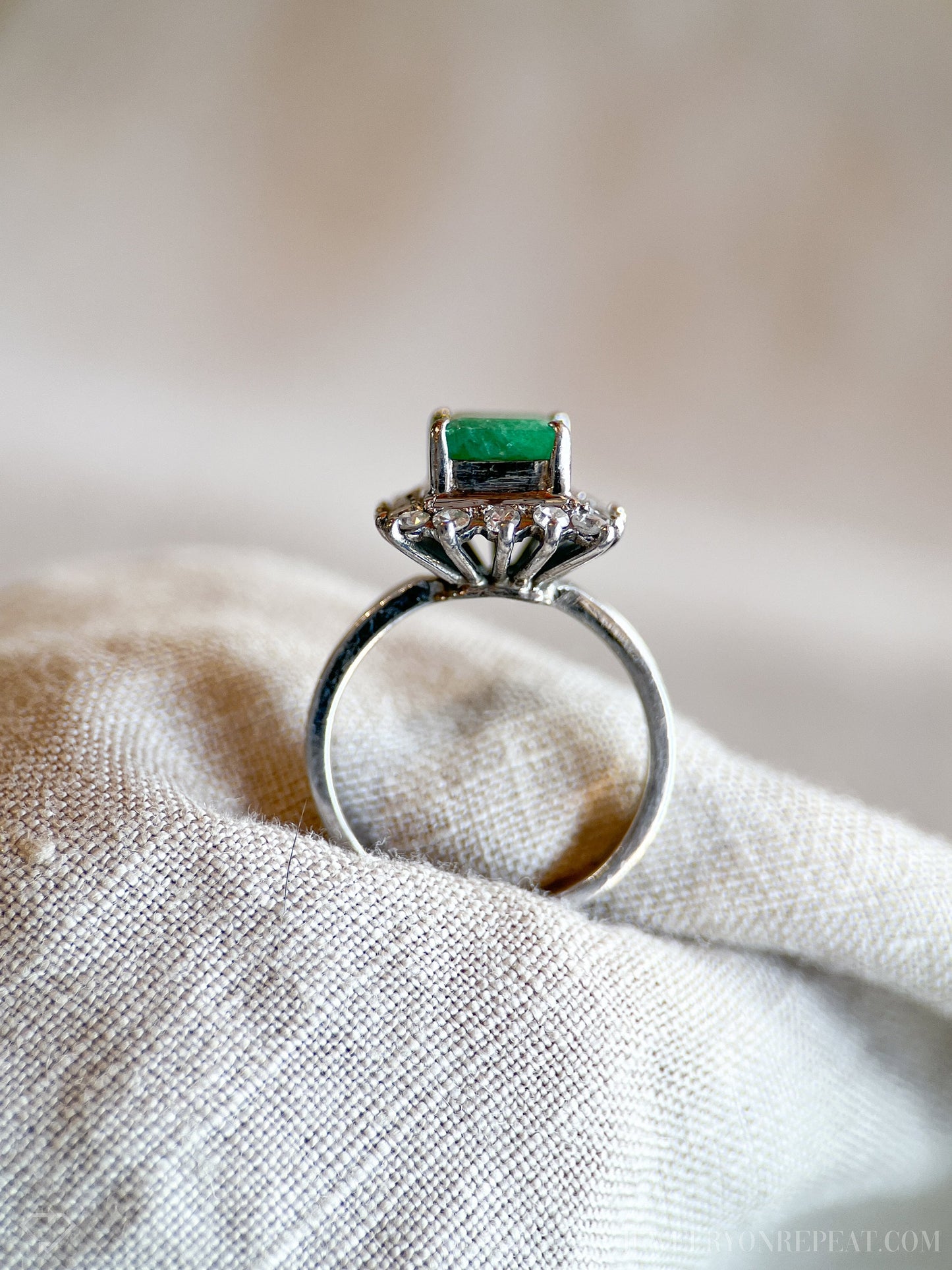 Vintage Emerald and Diamond Halo Gemstone Ring in 18k White Gold