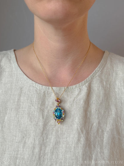 Vintage 1990s Blue Topaz Rainbow Halo Pendant, 14k Gold